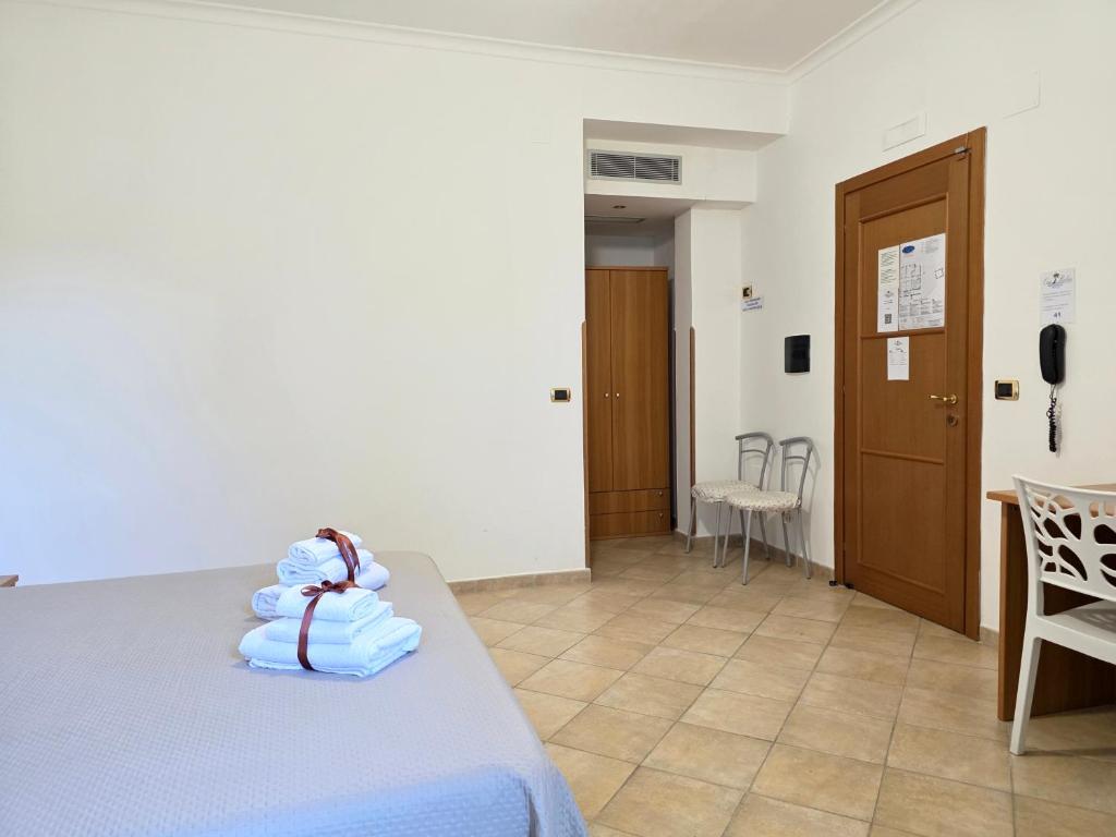 Postel nebo postele na pokoji v ubytování Oasi Relais
