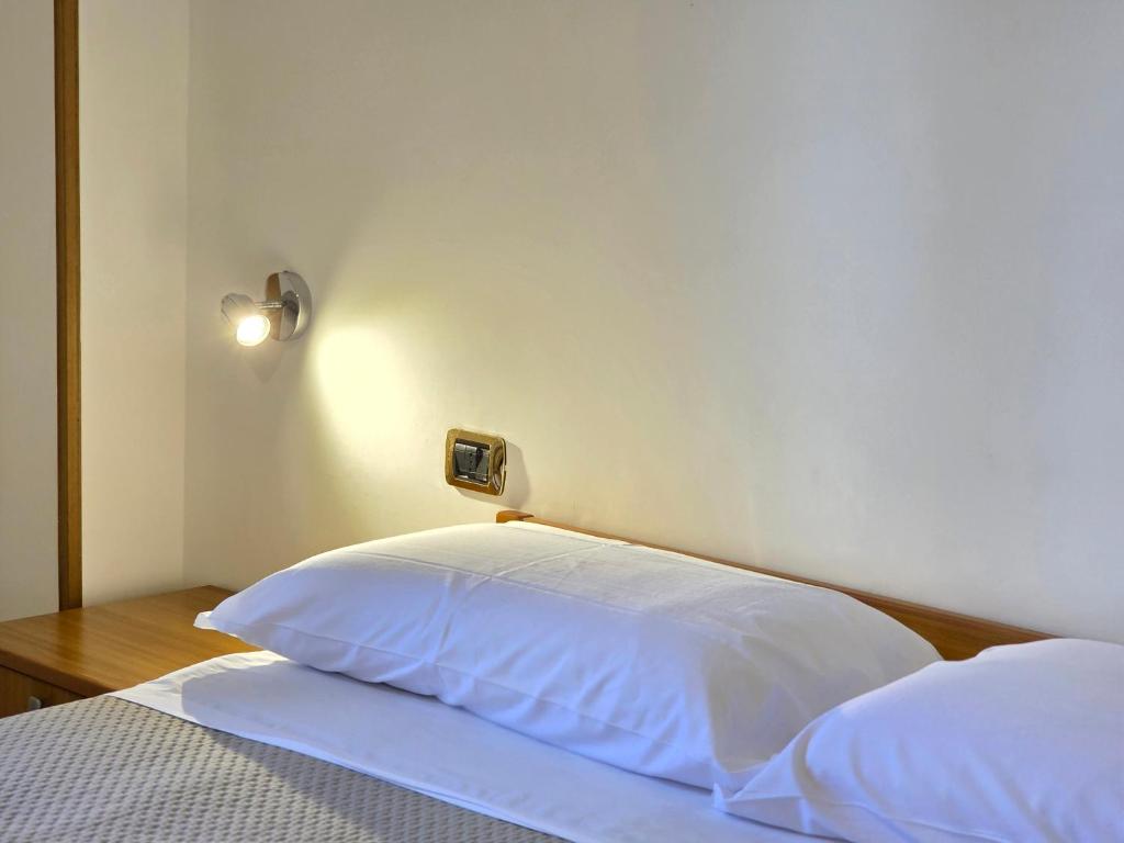 Postel nebo postele na pokoji v ubytování Oasi Relais
