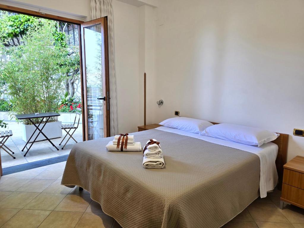 Postel nebo postele na pokoji v ubytování Oasi Relais