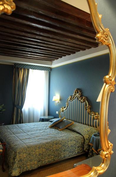 Postel nebo postele na pokoji v ubytování Hotel Corte Contarina