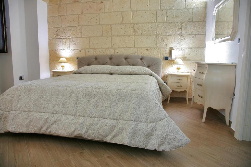 Postel nebo postele na pokoji v ubytování L'Angolo del Salento