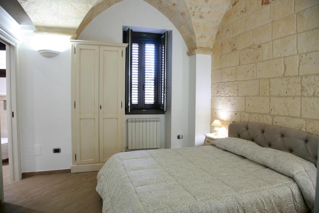 Postel nebo postele na pokoji v ubytování L'Angolo del Salento