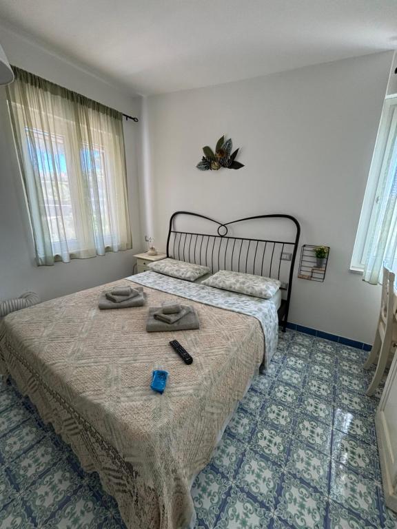 Postel nebo postele na pokoji v ubytování B&B La Marinella