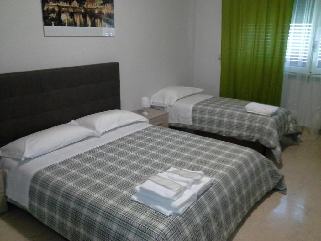 Posteľ alebo postele v izbe v ubytovaní Olimpica Relais guest house