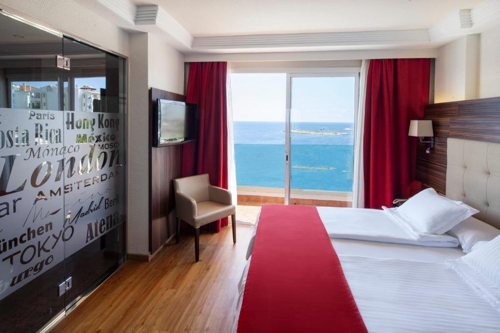 A bed or beds in a room at Europe Playa Marina - Adults Only