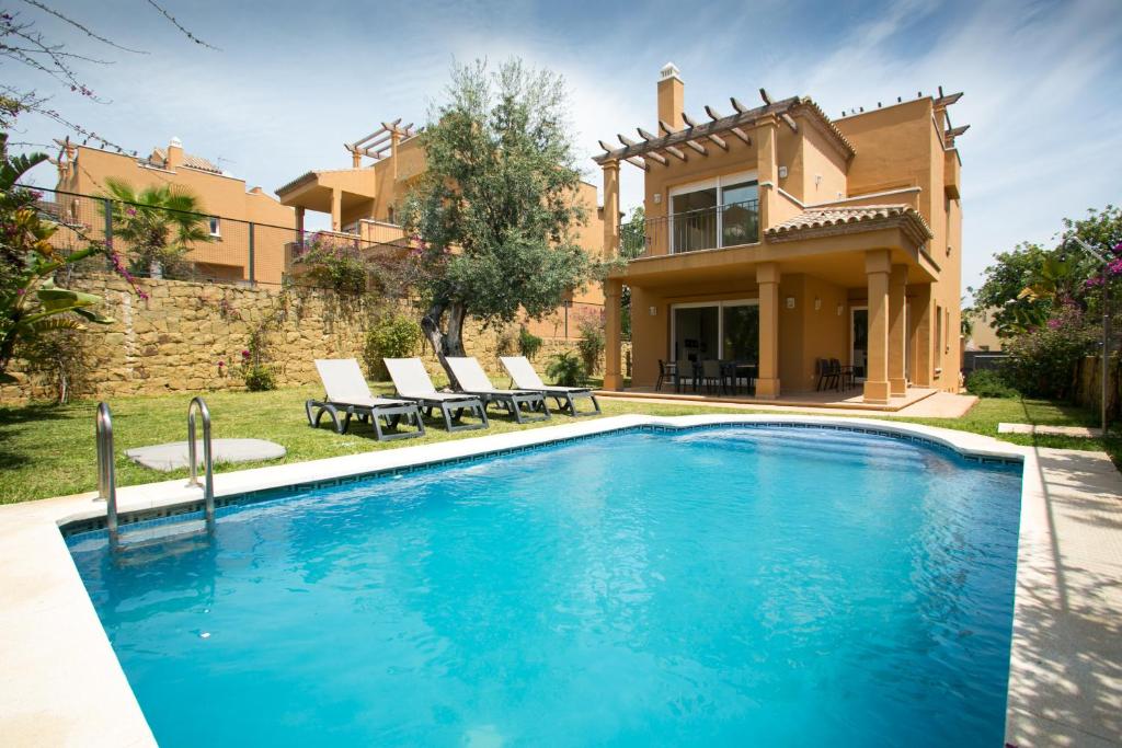 a large swimming pool in a house at Villas Altos De Marbella in Marbella