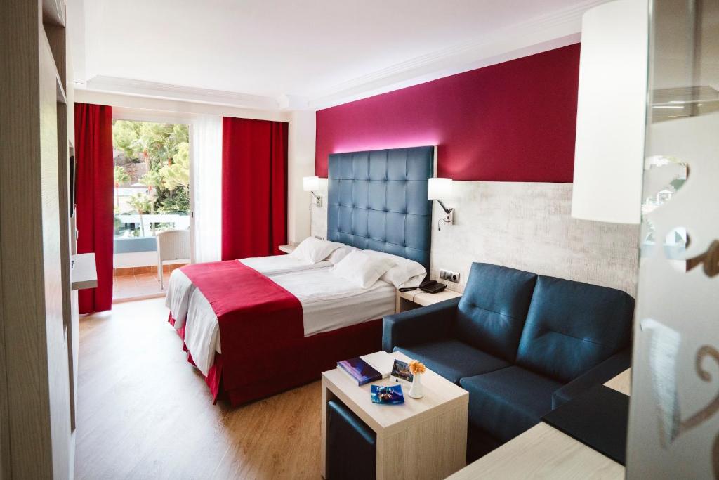 A bed or beds in a room at Europe Playa Marina - Adults Only