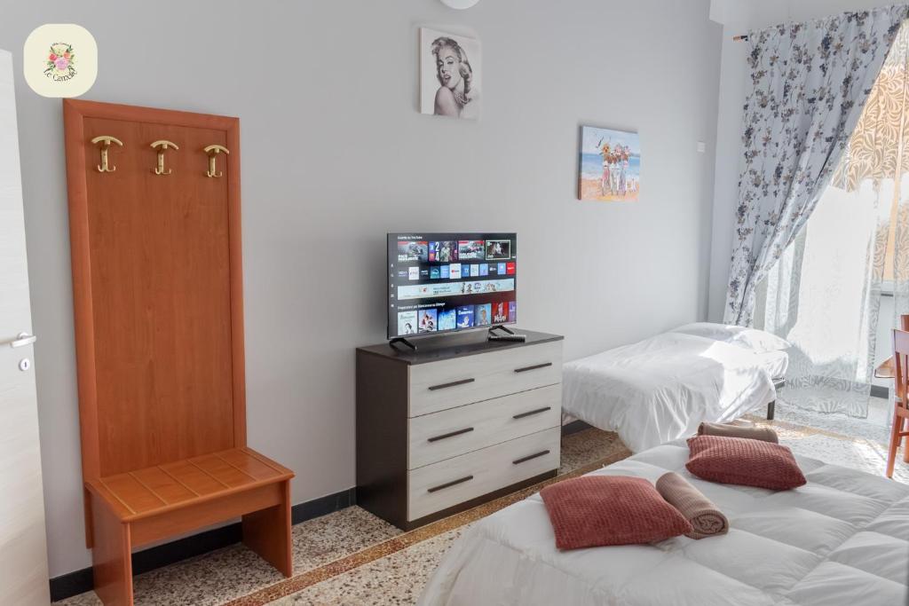 Postel nebo postele na pokoji v ubytování Le Camelie