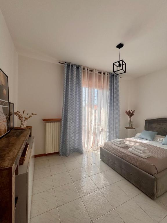 Postel nebo postele na pokoji v ubytování Garda Lake Holiday Apartments quadrilocale
