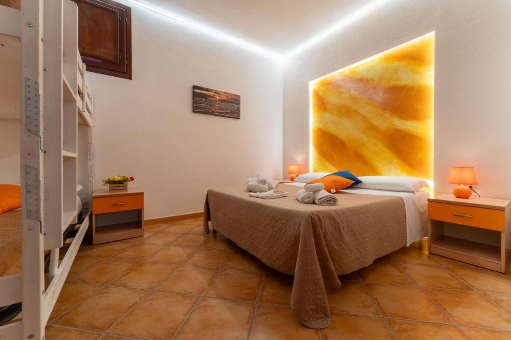 Postel nebo postele na pokoji v ubytování "L'Oasi di Favignana" Room and Charme
