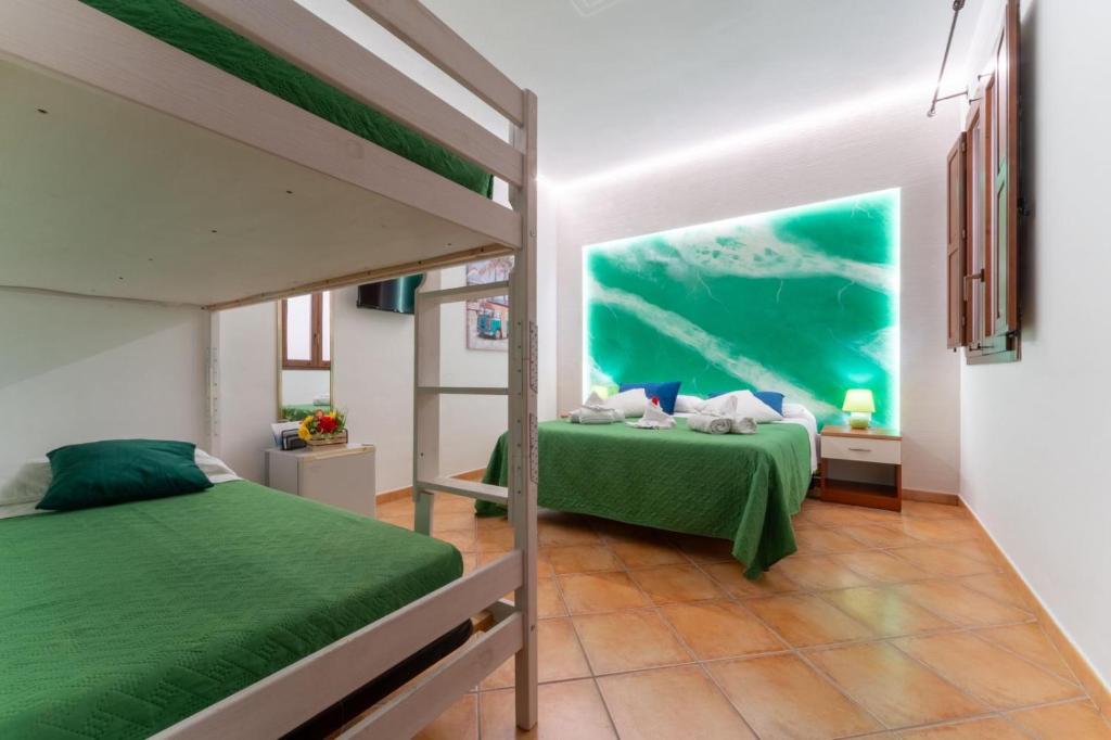 Postel nebo postele na pokoji v ubytování "L'Oasi di Favignana" Room and Charme