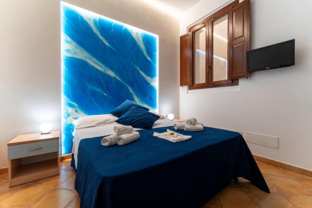 Postel nebo postele na pokoji v ubytování "L'Oasi di Favignana" Room and Charme