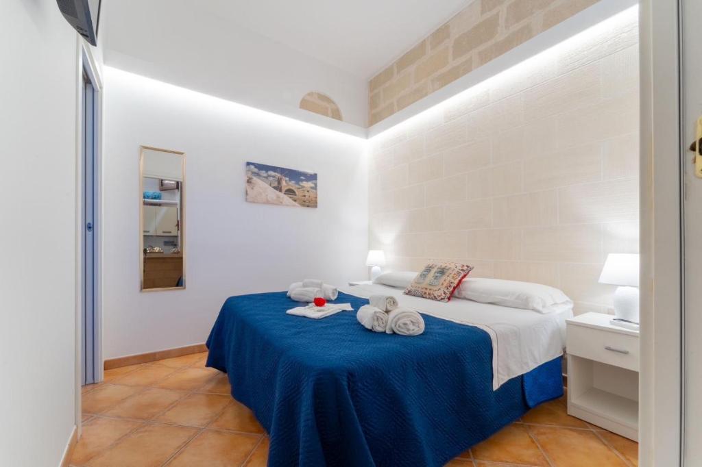 Postel nebo postele na pokoji v ubytování "L'Oasi di Favignana" Room and Charme