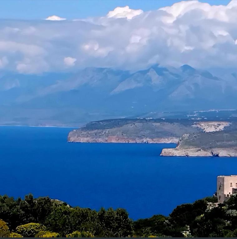 a view of a large body of water with mountains at Mani Fort Charabos in Ayía Kiriakí