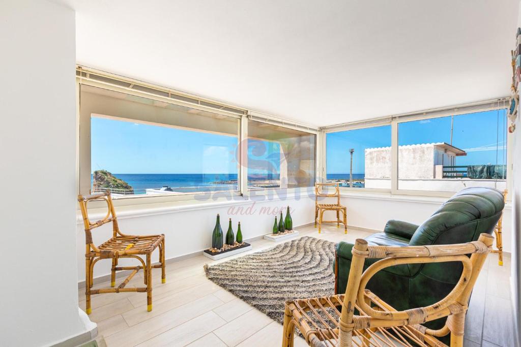 a living room with a view of the ocean at Salentoandmore-Stella del mare in Torre Pali