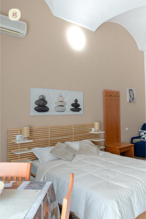 Postel nebo postele na pokoji v ubytování Le Camelie