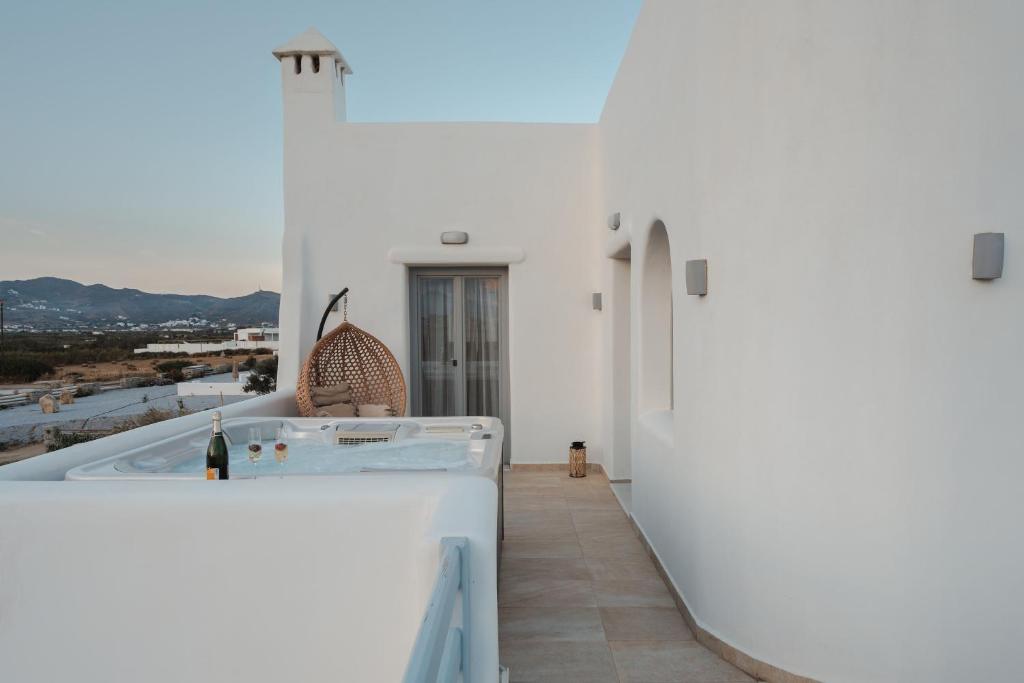 a view from the balcony of a house with a hot tub at Villas vaya in Naxos Chora