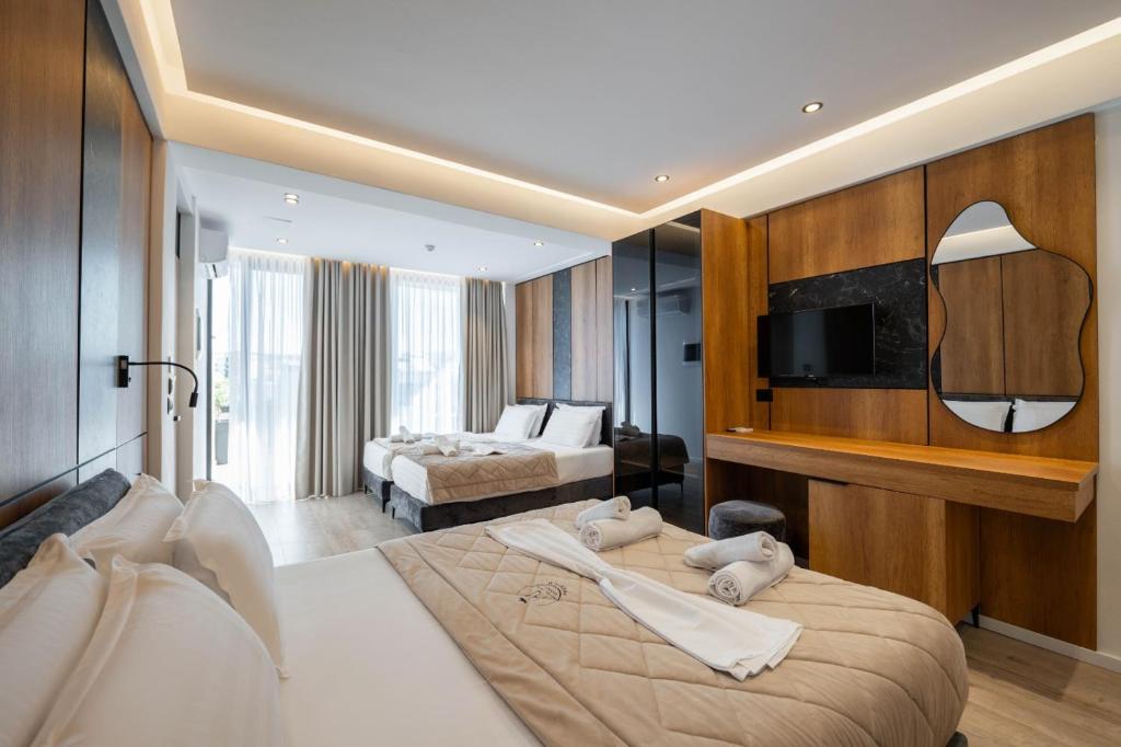 Postel nebo postele na pokoji v ubytování Hotel Joni