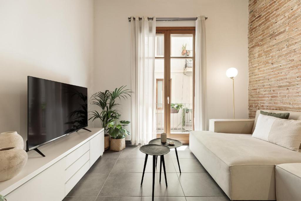 TV a/nebo společenská místnost v ubytování Ola Living MACBA