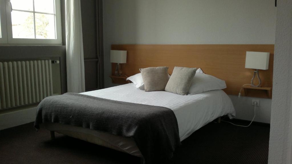 Postel nebo postele na pokoji v ubytování Hôtel la Régie