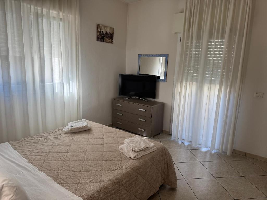 Postel nebo postele na pokoji v ubytování Residence VAPORE