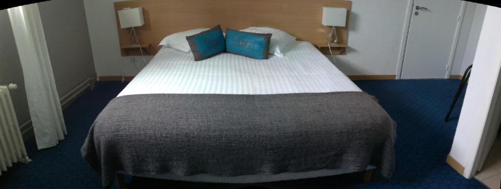 Postel nebo postele na pokoji v ubytování Hôtel la Régie