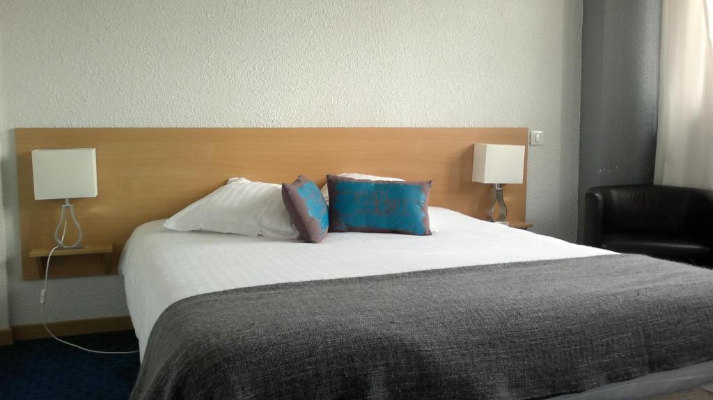 Postel nebo postele na pokoji v ubytování Hôtel la Régie