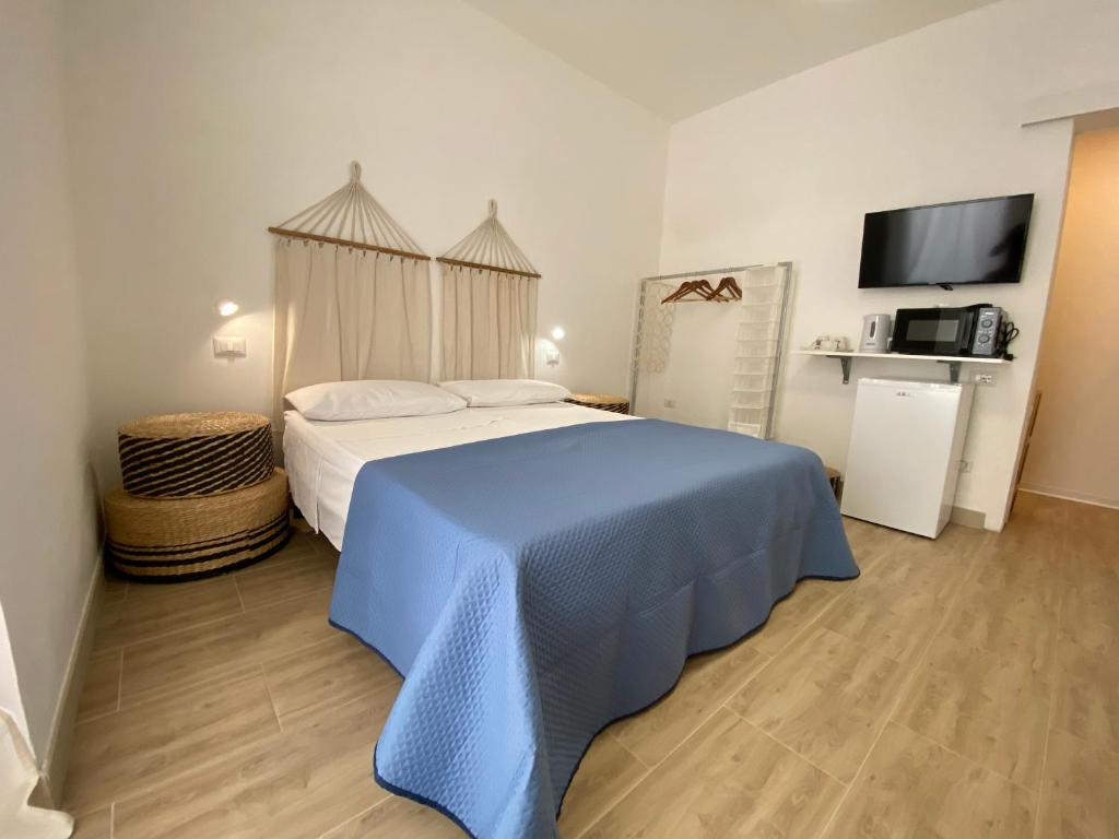 Postel nebo postele na pokoji v ubytování Isid'Oro Rooms
