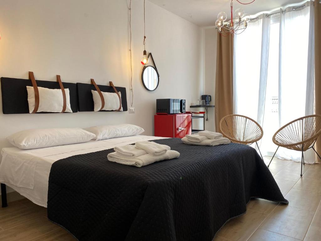 Postel nebo postele na pokoji v ubytování Isid'Oro Rooms