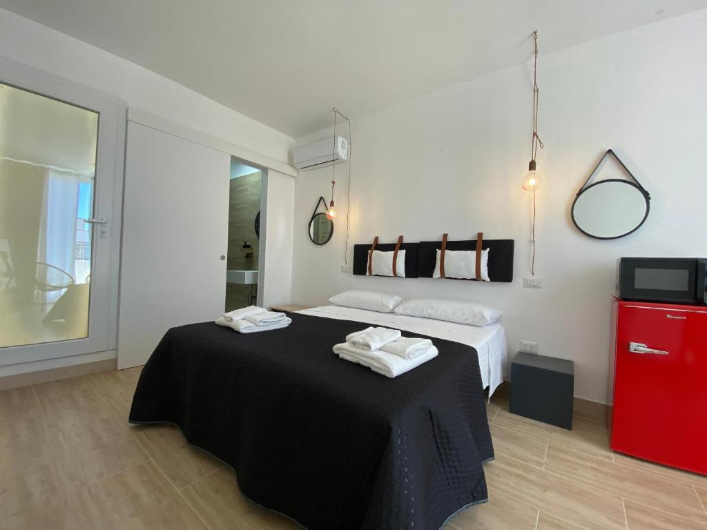 Postel nebo postele na pokoji v ubytování Isid'Oro Rooms