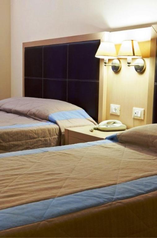 Postel nebo postele na pokoji v ubytování Lassi Hotel