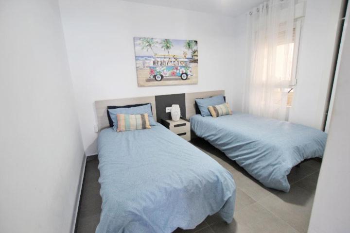 Postel nebo postele na pokoji v ubytování Apartamento Primera Línea Playa Centro de Guardamar