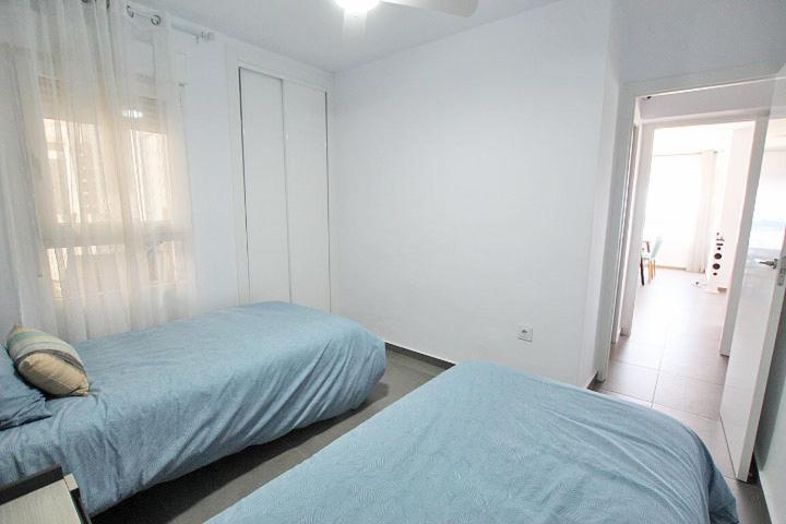 Postel nebo postele na pokoji v ubytování Apartamento Primera Línea Playa Centro de Guardamar