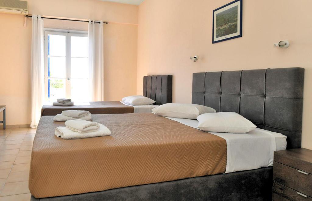 Postel nebo postele na pokoji v ubytování Vanas Apartments