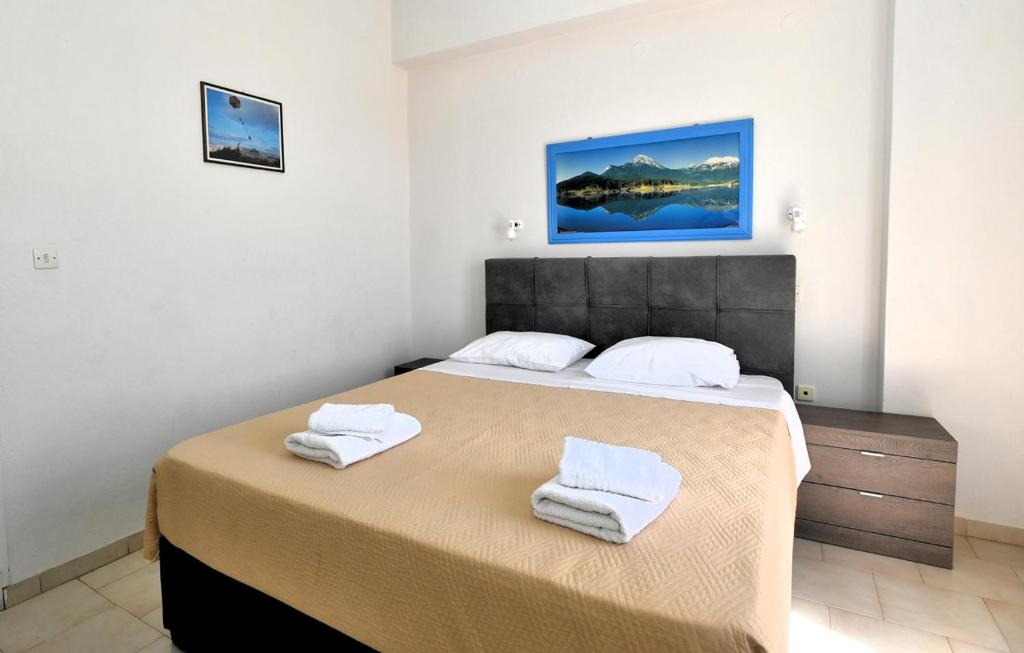 Postel nebo postele na pokoji v ubytování Vanas Apartments