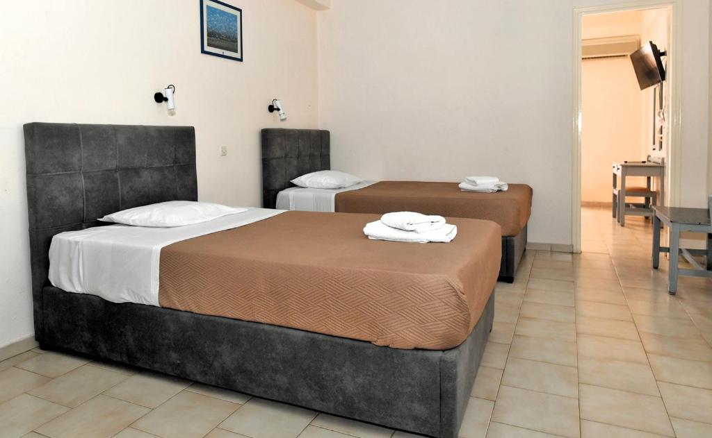 Postel nebo postele na pokoji v ubytování Vanas Apartments