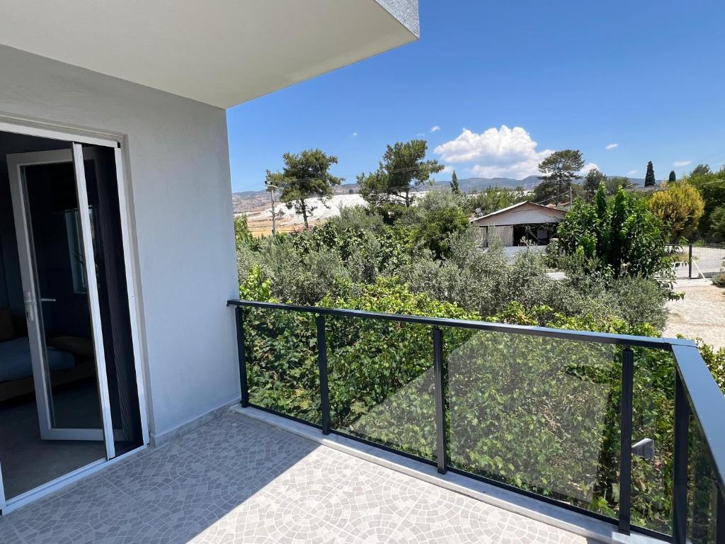 a balcony with a view of a yard at Panorama house in Denizli