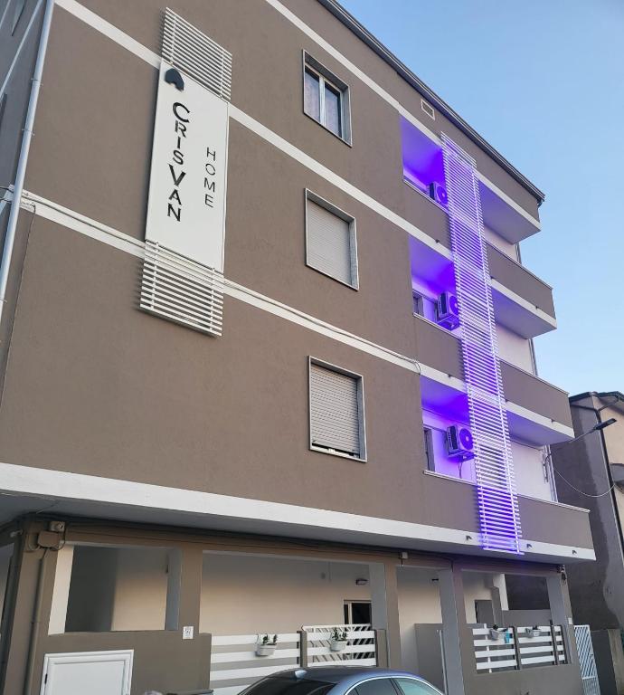 a building with purple lights on the side of it at Crisvan Home in Capo Rizzuto
