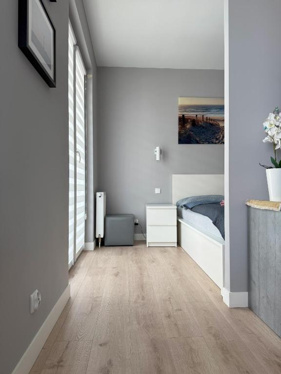 Łóżko lub łóżka w pokoju w obiekcie Apartament Bałtyk - WAP