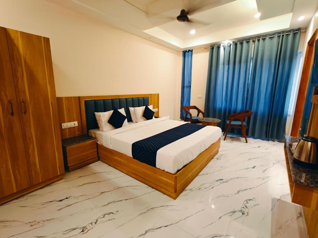 Postel nebo postele na pokoji v ubytování Hotel New Pratap