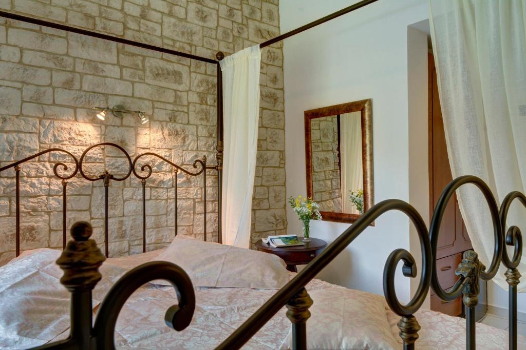 Postel nebo postele na pokoji v ubytování Hotel Agnadi - Horefto