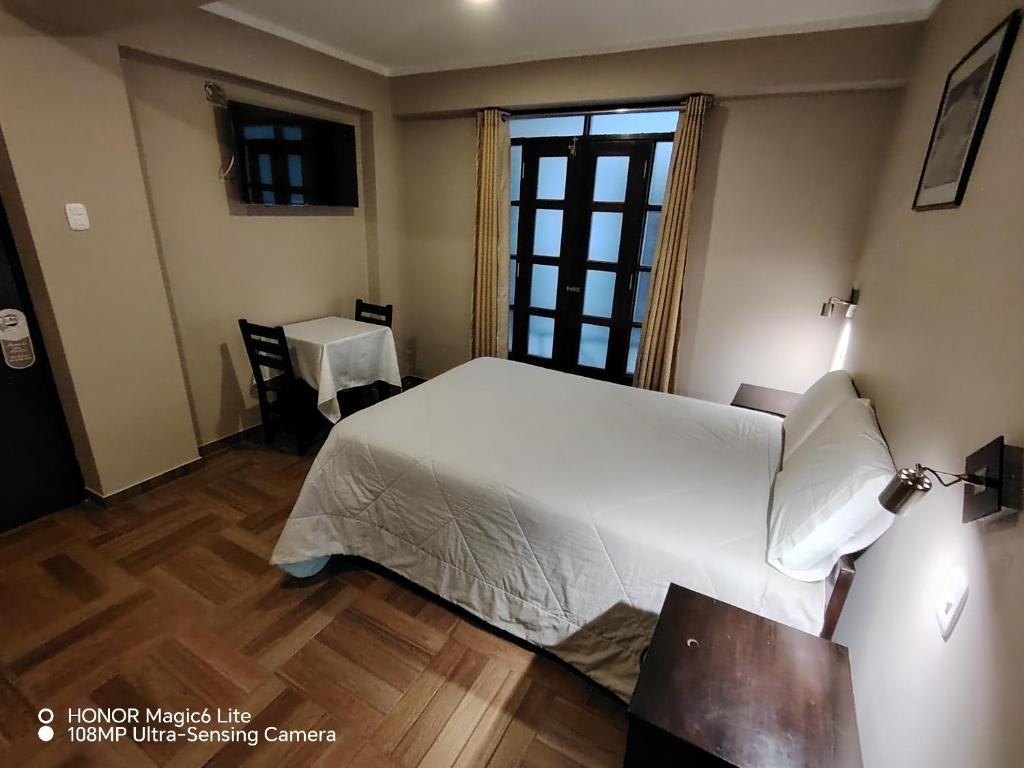 Rúm í herbergi á Hotel Golden Killa