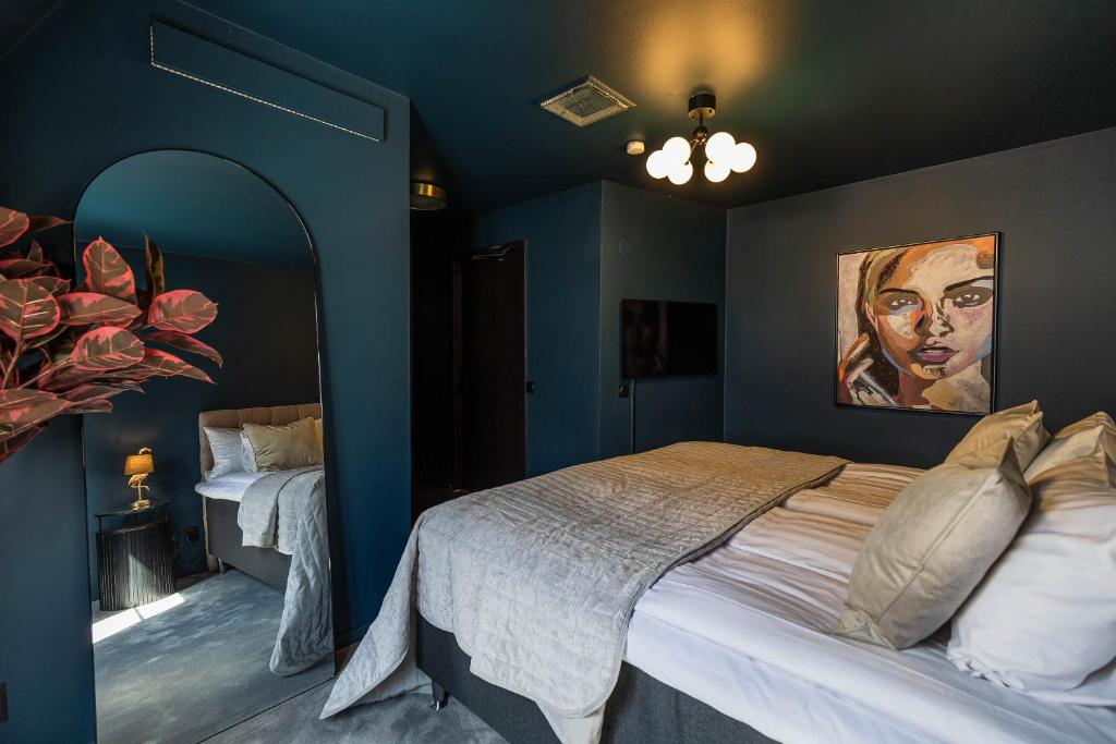Postel nebo postele na pokoji v ubytování Villa Gutebagge Hotell