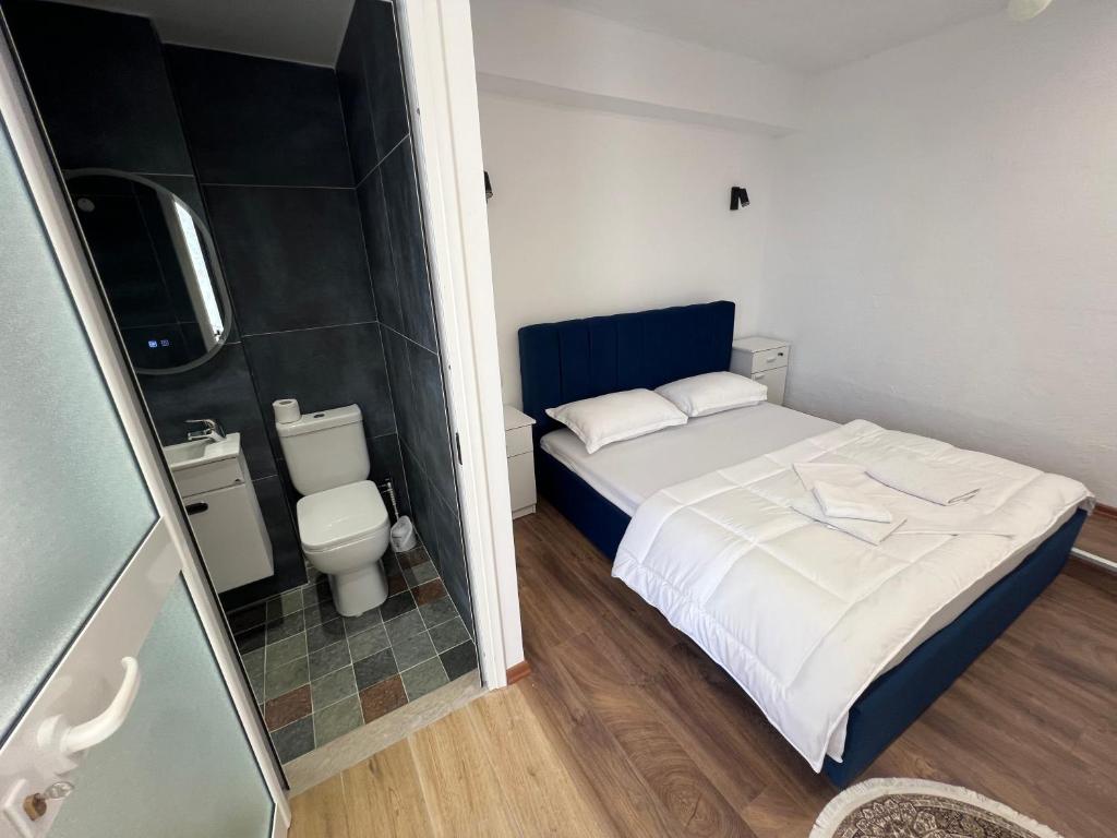 Postel nebo postele na pokoji v ubytování Iart Residence