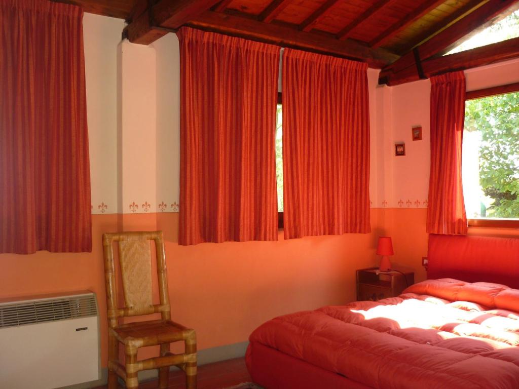 Postel nebo postele na pokoji v ubytování B&B Casale Ginette