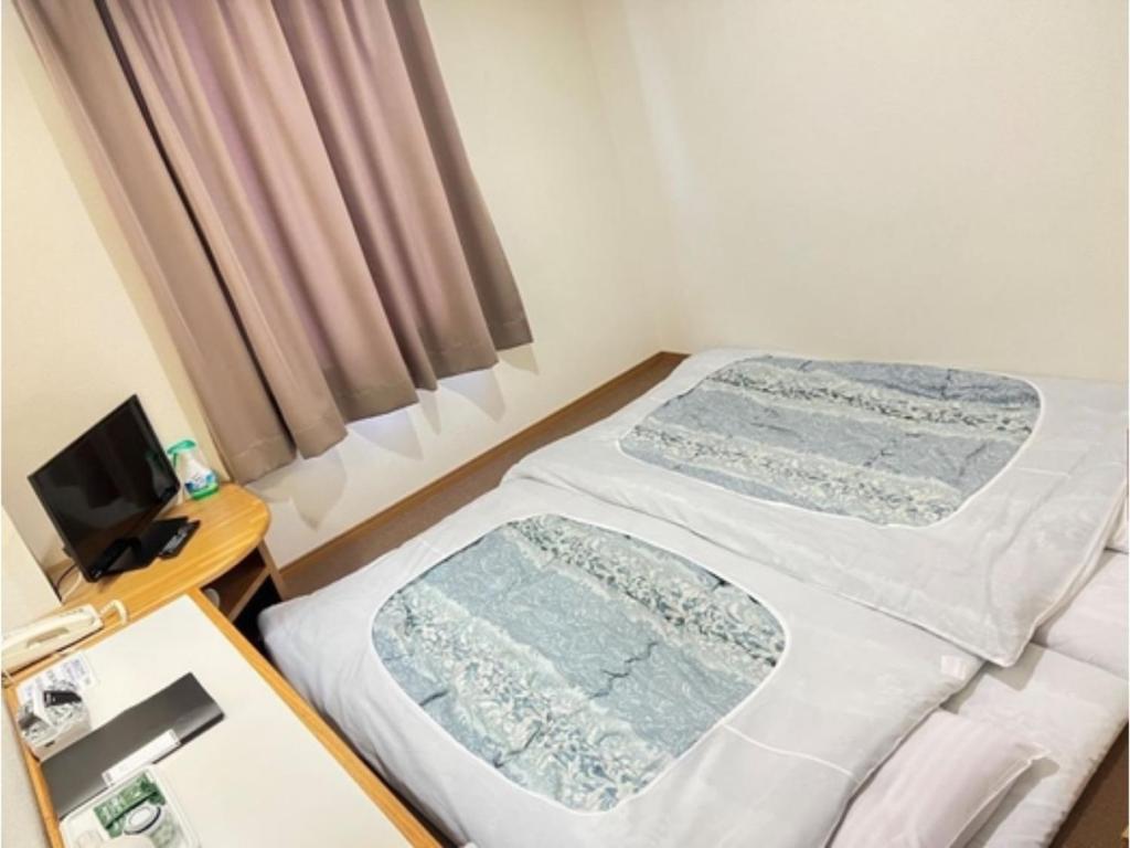 Кровать или кровати в номере Hotel Tetora Hachinohe - Vacation STAY 38112v