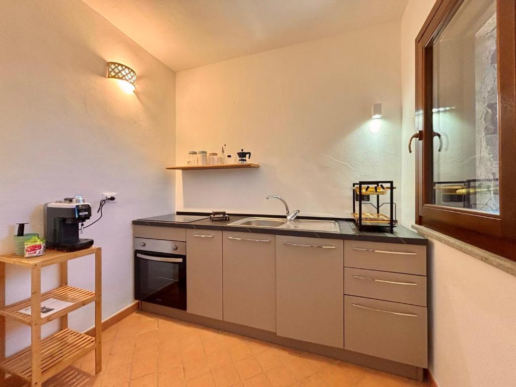 Kuchyň nebo kuchyňský kout v ubytování Ciuri di Pantelleria Dammusi