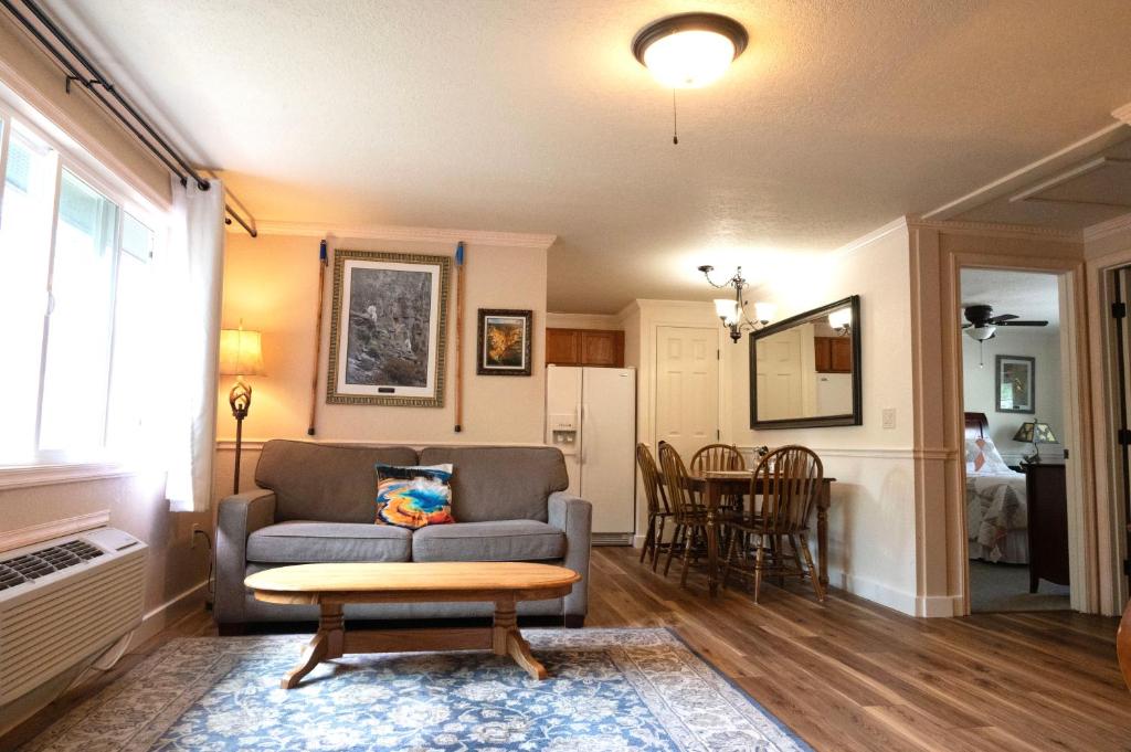 a living room with a couch and a table at Yellowstone Gateway Inn in Gardiner