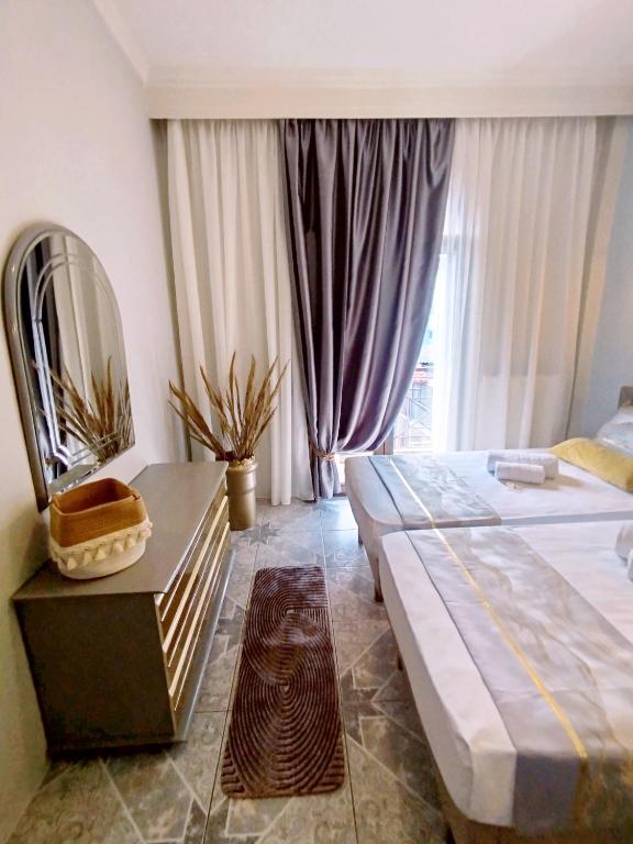 Ein Bett oder Betten in einem Zimmer der Unterkunft Sunrise Suite
