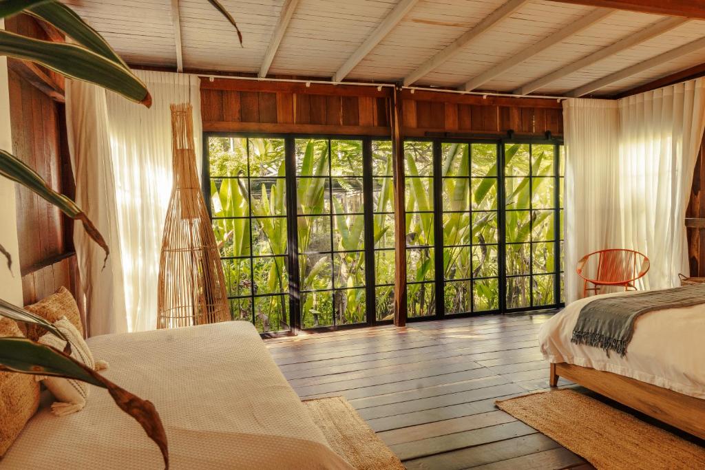 Postel nebo postele na pokoji v ubytování Solea Villa Tropical